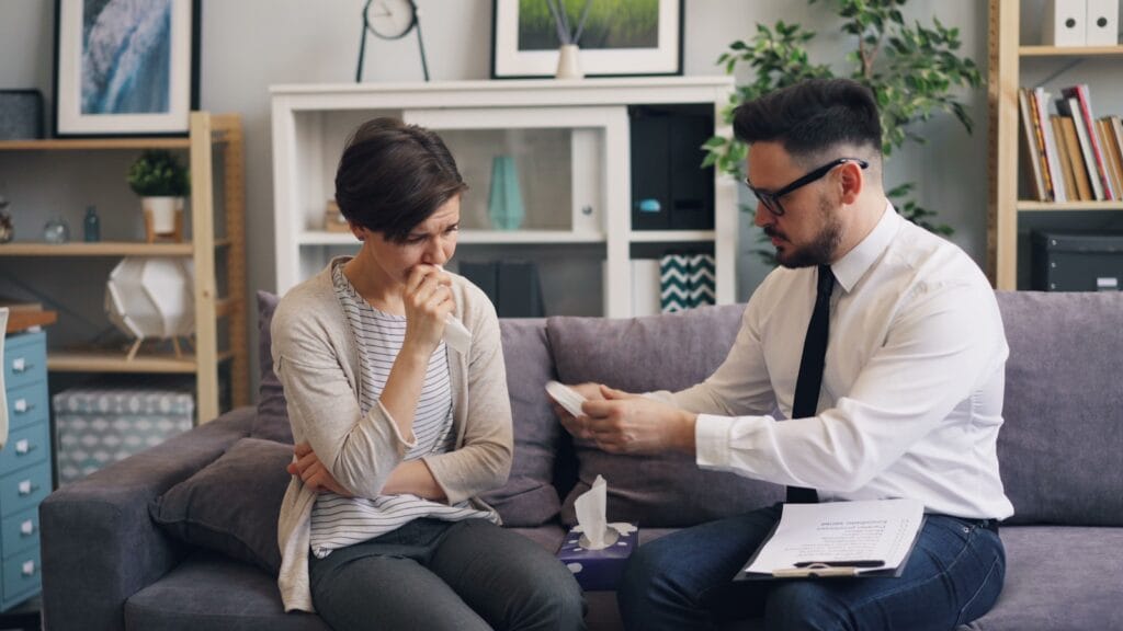a man and a woman sitting on a couch